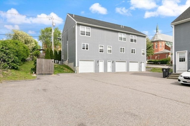 54 Primrose St Unit 3, Haverhill, MA 01830 - back of property with a garage and driveway