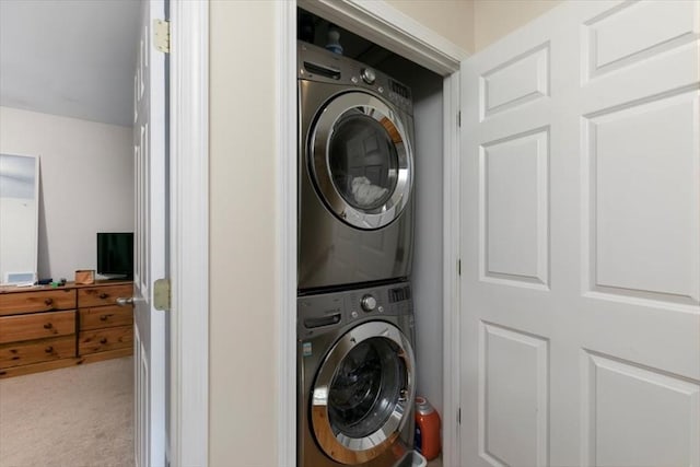 54 Primrose St Unit 3, Haverhill, MA 01830 - washroom featuring stacked washer / drying machine and carpet flooring