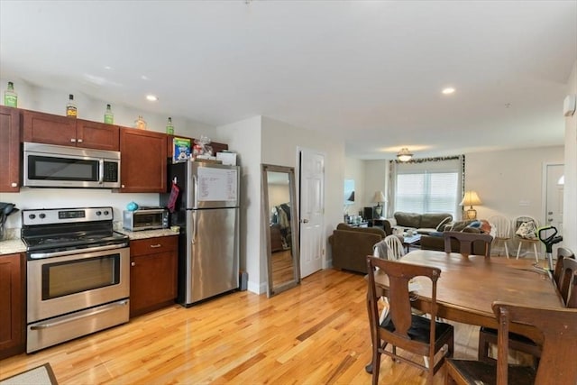 54 Primrose St Unit 3, Haverhill, MA 01830 - kitchen featuring stainless steel appliances, light wood-style flooring, open floor plan, and recessed lighting