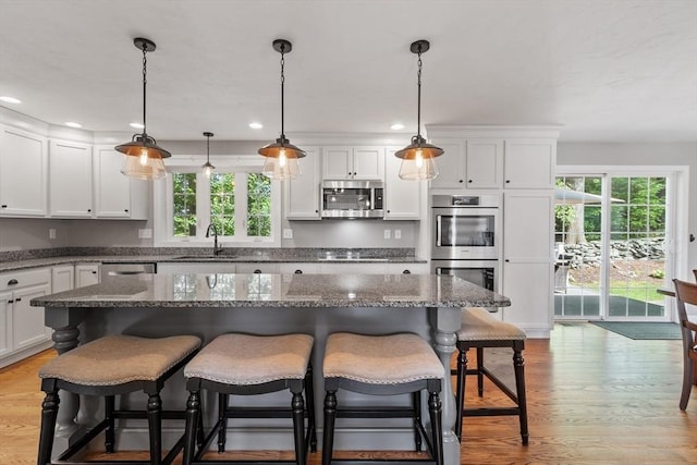 3 Chad Ln, Sterling, MA 01564 - kitchen with appliances with stainless steel finishes, a sink, plenty of natural light, white cabinetry, and recessed lighting