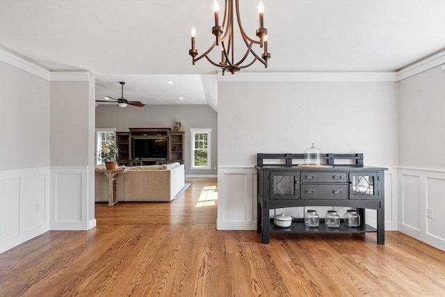 3 Chad Ln, Sterling, MA 01564 - dining room with a decorative wall, ceiling fan, a chandelier, wood finished floors, and a wainscoted wall