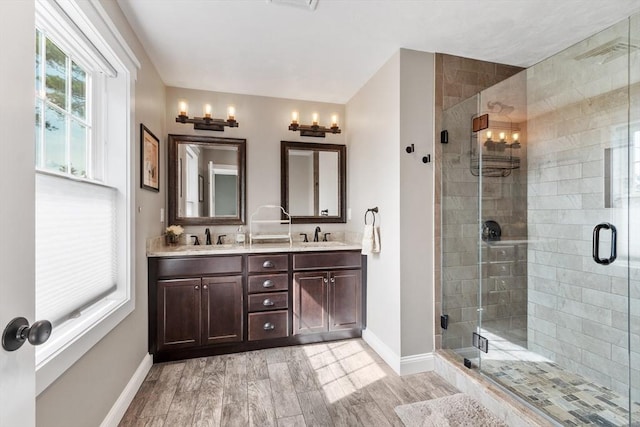3 Chad Ln, Sterling, MA 01564 - full bathroom with double vanity, baseboards, and a shower stall