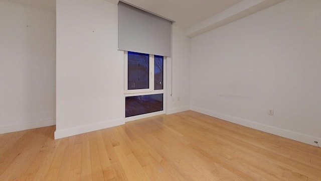 unfurnished room featuring wood-type flooring