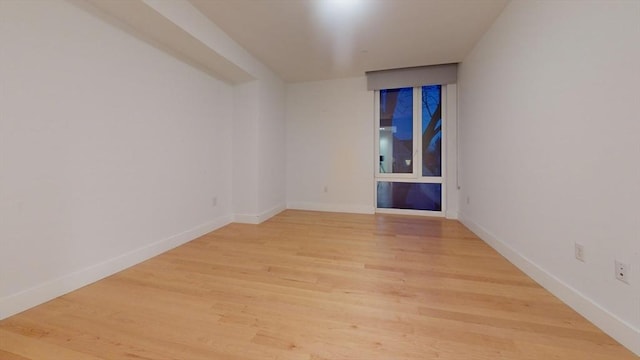 empty room featuring wood-type flooring