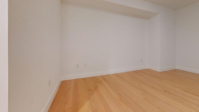 empty room with hardwood / wood-style floors