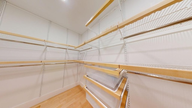 walk in closet featuring hardwood / wood-style floors