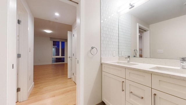 bathroom with hardwood / wood-style floors and vanity