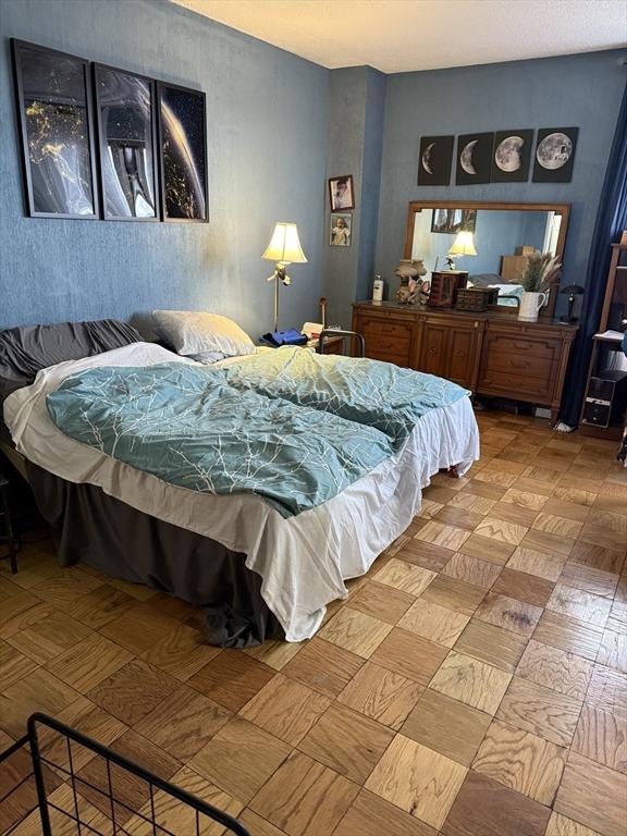 bedroom featuring parquet floors