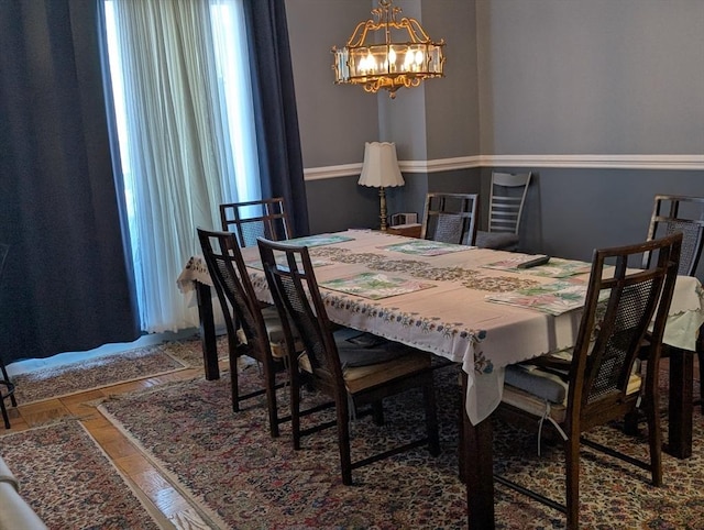 dining room with a notable chandelier