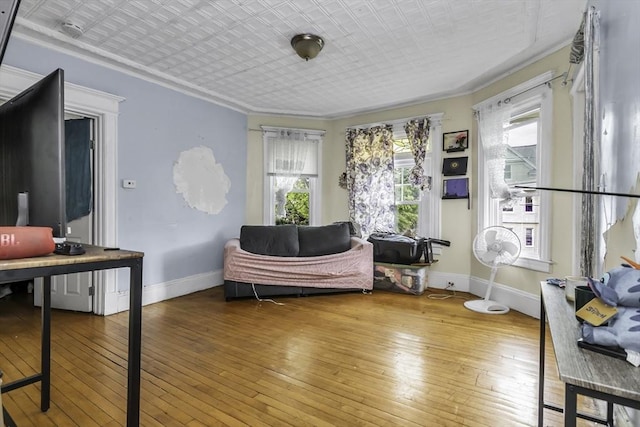 77-79 Grenada Ter, Springfield, MA 01108 - living room featuring baseboards, hardwood / wood-style floors, ornamental molding, and an ornate ceiling
