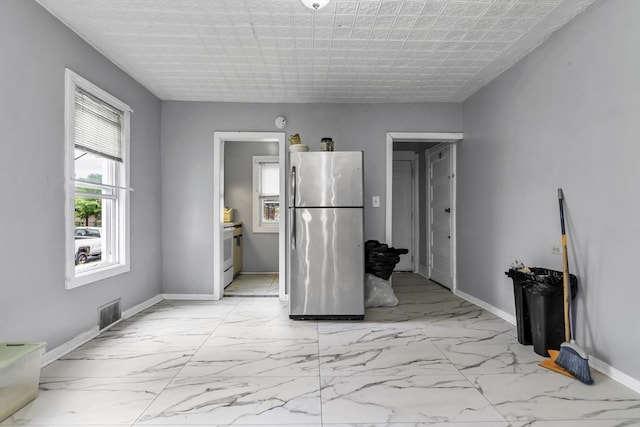 77-79 Grenada Ter, Springfield, MA 01108 - spare room with light marble finish flooring and baseboards