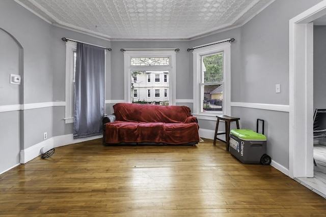 77-79 Grenada Ter, Springfield, MA 01108 - living area with ornamental molding, wood-type flooring, and baseboards