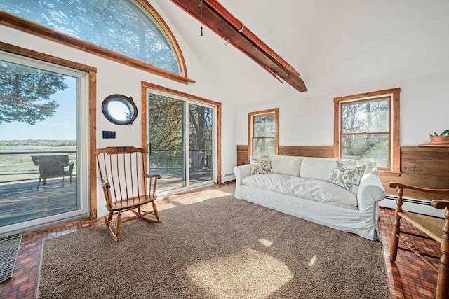 living room with baseboard heating, high vaulted ceiling, wainscoting, and beam ceiling