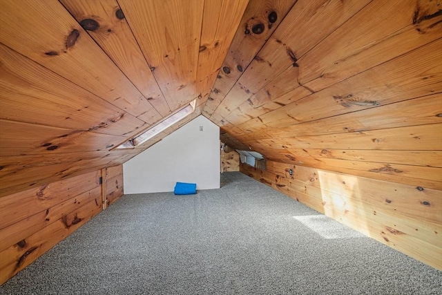 bonus room featuring wood ceiling, wood walls, carpet floors, and lofted ceiling
