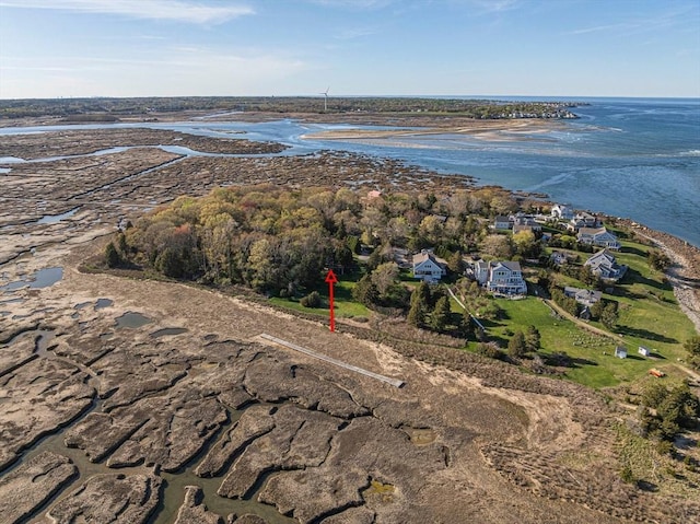 aerial view of property and surrounding area with a nearby body of water
