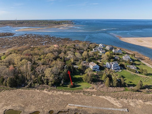 aerial view of property's location with a nearby body of water