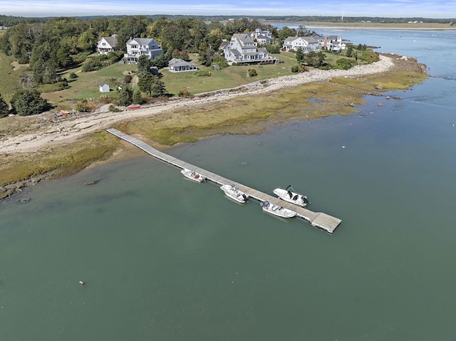 aerial view of property and surrounding area with a large body of water