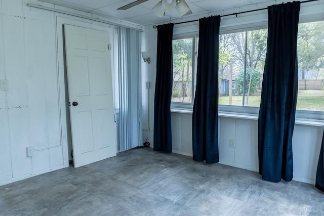spare room with a ceiling fan