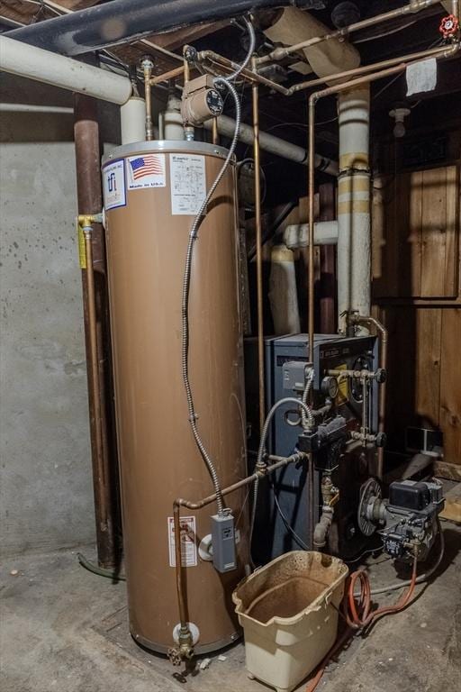 utility room featuring water heater