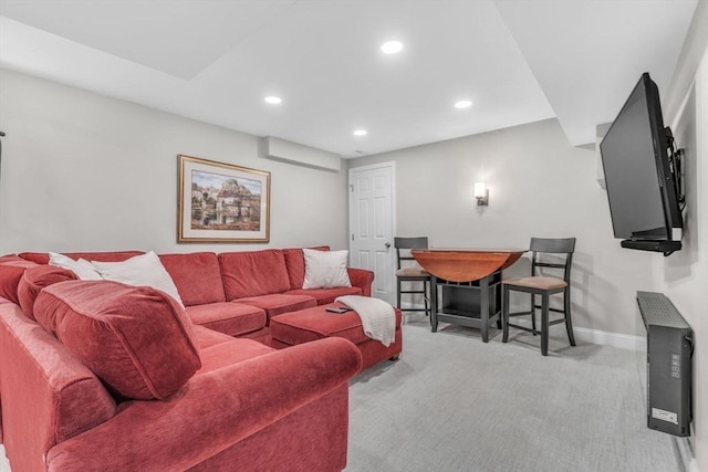 carpeted living area featuring recessed lighting and baseboards