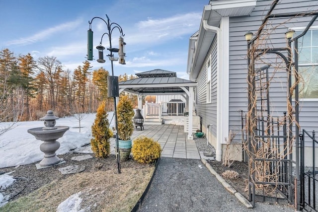 view of patio / terrace featuring a wooden deck and a gazebo