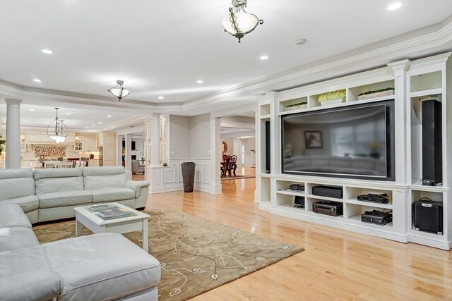42 Westerly Rd, Weston, MA 02493 - living area featuring ornate columns, crown molding, light wood-style flooring, recessed lighting, and wainscoting