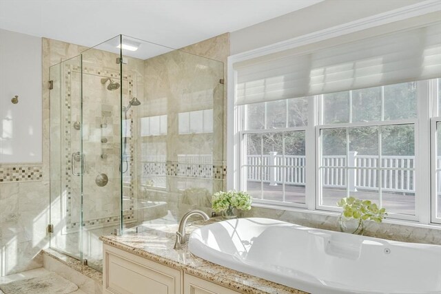 42 Westerly Rd, Weston, MA 02493 - bathroom with tile walls, a garden tub, a shower stall, and healthy amount of natural light