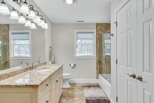42 Westerly Rd, Weston, MA 02493 - bathroom featuring baseboards, vanity, marble finish flooring, toilet, and enclosed tub / shower combo