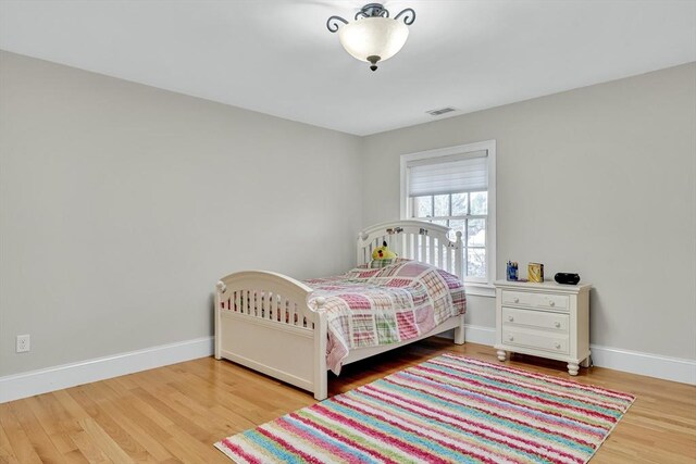 42 Westerly Rd, Weston, MA 02493 - bedroom featuring wood finished floors and baseboards