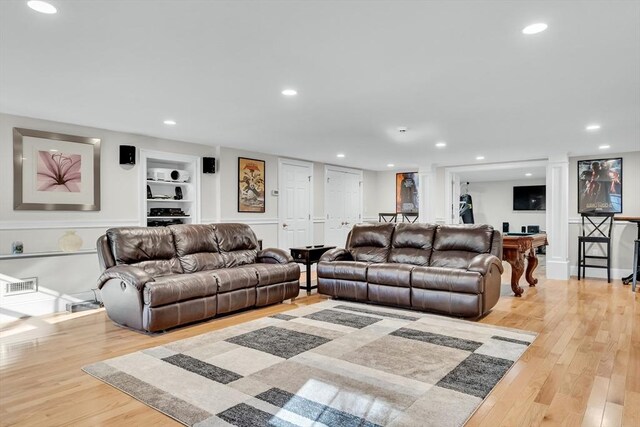 42 Westerly Rd, Weston, MA 02493 - living area with built in features, wood finished floors, and recessed lighting