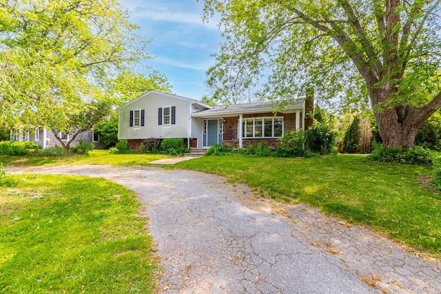 49 Broken Bow Ln, Falmouth, MA 02536 - split level home with a front yard and driveway