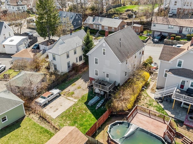 birds eye view of property with a residential view