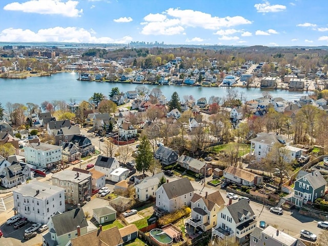 bird's eye view featuring a residential view and a water view
