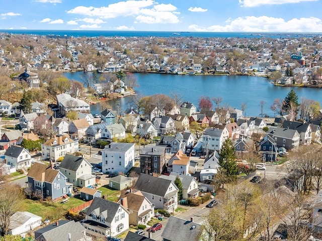 drone / aerial view with a water view and a residential view