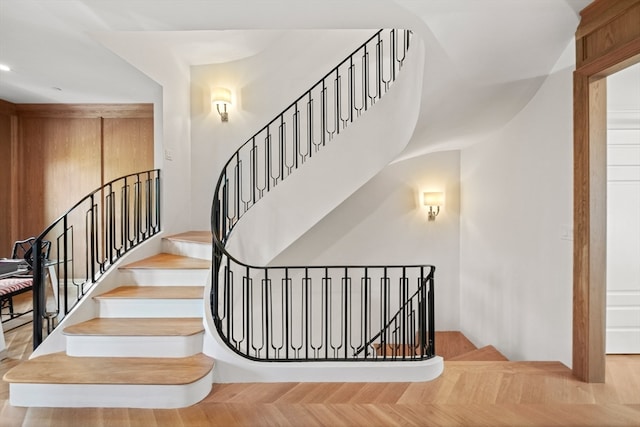 stairway with hardwood / wood-style floors