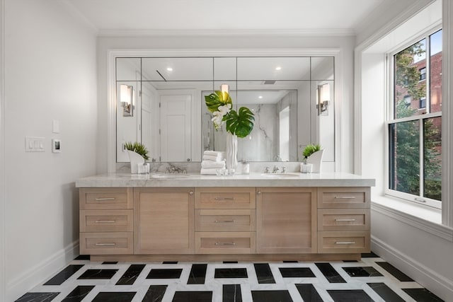 bathroom with ornamental molding and vanity