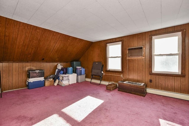 bonus room featuring a wall mounted air conditioner, vaulted ceiling, and wood walls