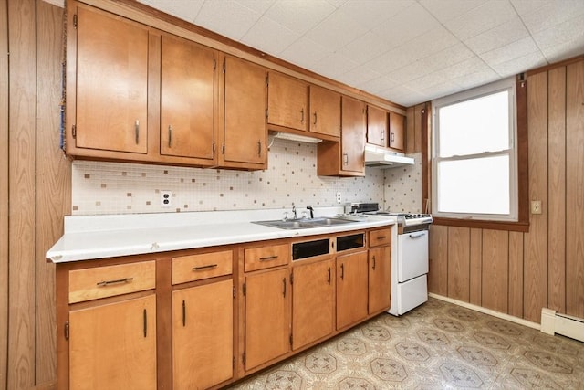 kitchen with white gas range, sink, and a baseboard heating unit