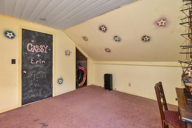 bonus room with carpet floors and vaulted ceiling