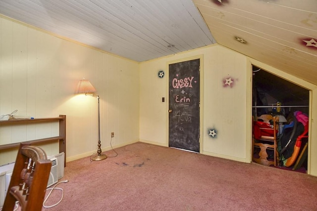 interior space with carpet and vaulted ceiling