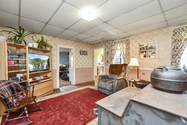 sitting room featuring a paneled ceiling and hardwood / wood-style flooring