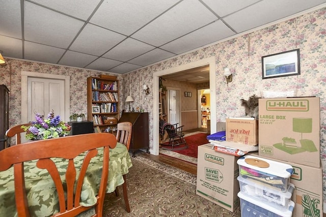 dining space with a drop ceiling