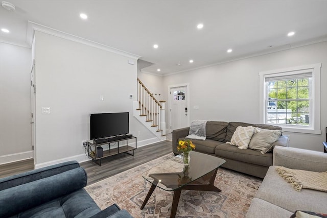 living room featuring crown molding, stairs, wood finished floors, baseboards, and recessed lighting
