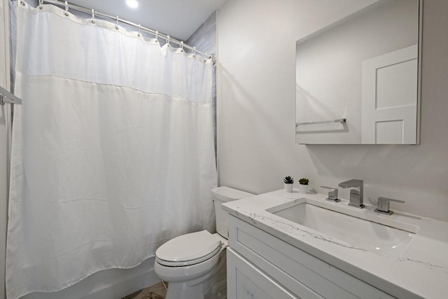 full bath featuring vanity, shower / bath combo, and toilet