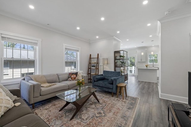 living room featuring recessed lighting, baseboards, dark wood finished floors, and ornamental molding