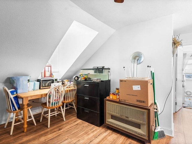 office space featuring wood finished floors and lofted ceiling