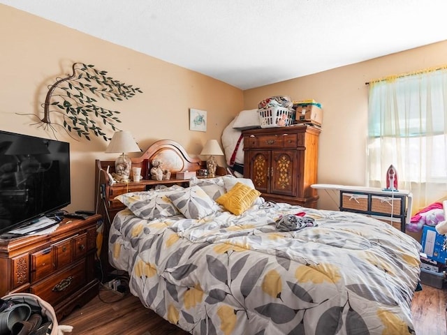 bedroom featuring wood finished floors