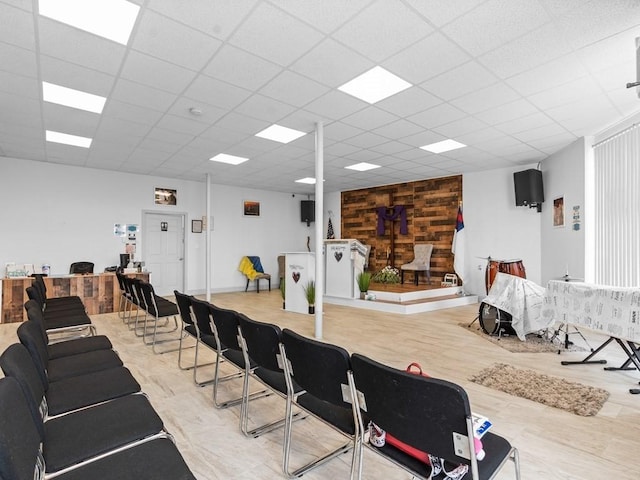 interior space with a paneled ceiling
