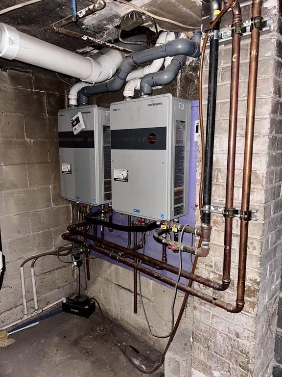 128 Mill St, Springfield, MA 01108 - utility room with tankless water heater