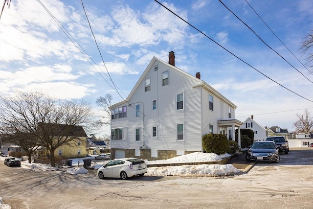 view of home's exterior featuring a chimney
